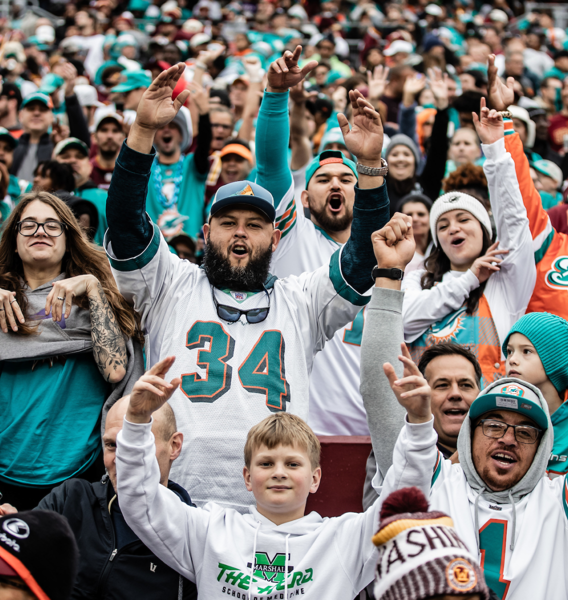 Large group of Dolphin fans cheering.