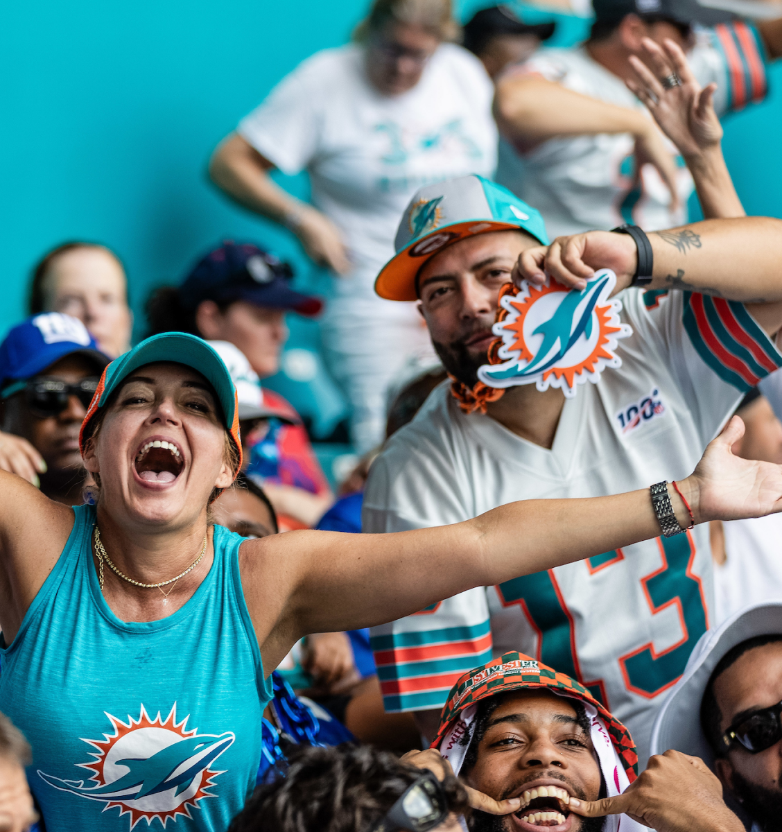 Smaller group of Dolphin fans cheering.