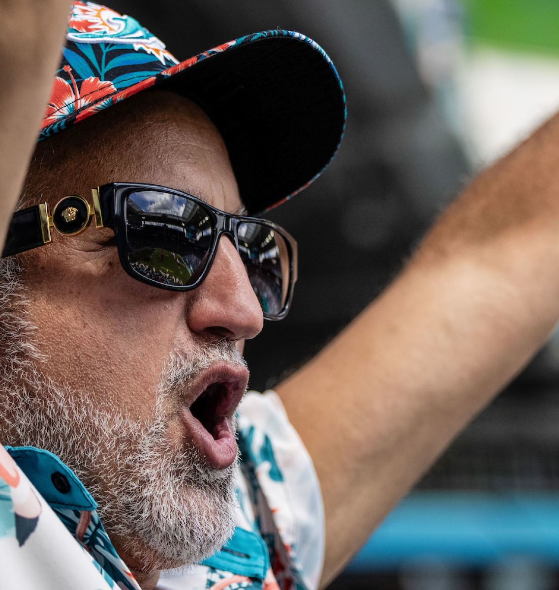 Man with grey beard cheering.