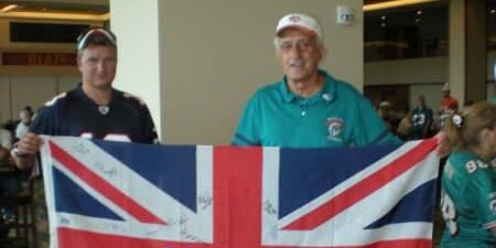 Dolfan UK club members holding up a flag