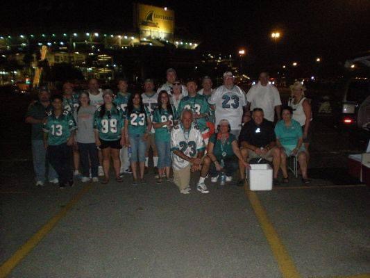 Dolfan UK fans outside of a stadium at night